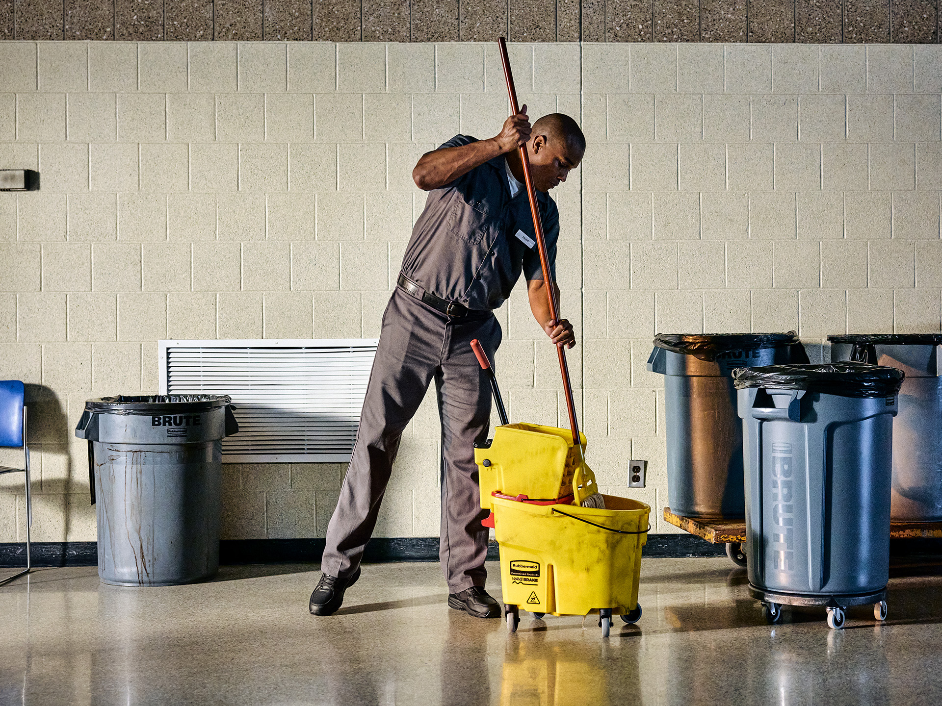 Man mopping floor.